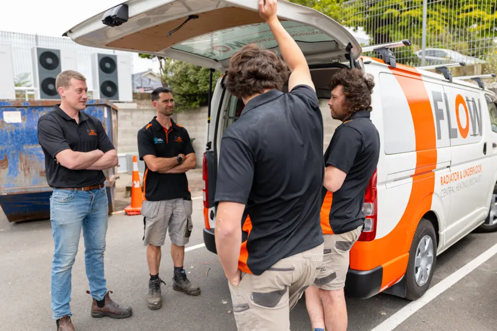 Flow Heating installers at the van before heading out to a job